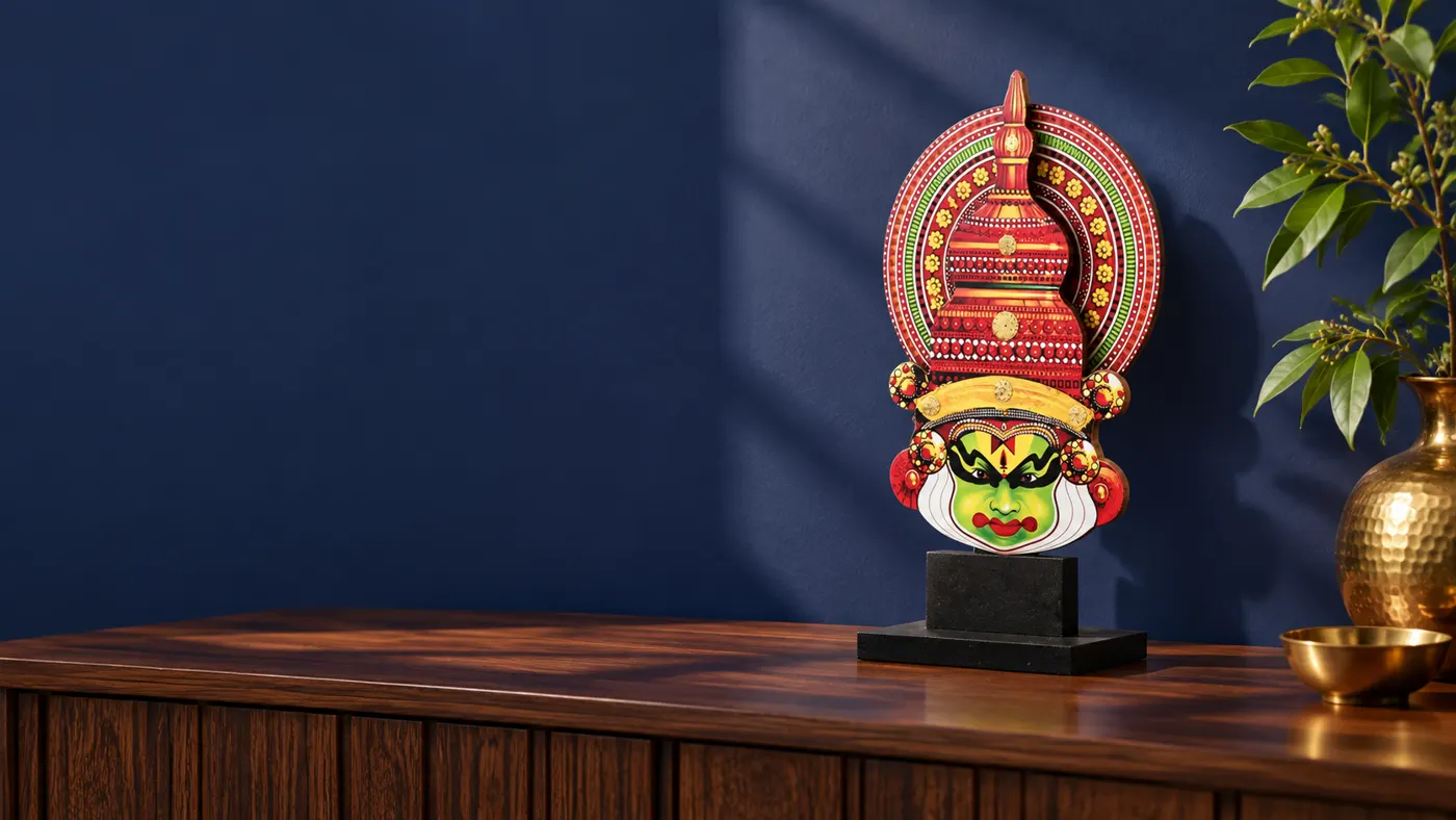NEWVEN Kathakali face stand styled on a walnut console against a navy wall